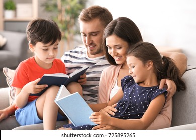 Happy family reading books at home - Powered by Shutterstock