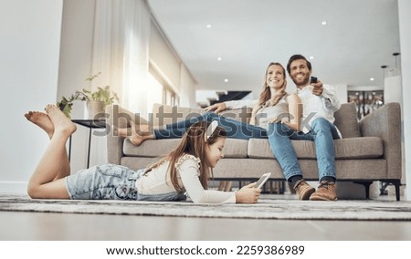 Happy family, relax or child on tablet in living room, house or home live streaming, movies channel or internet show bonding. Smile, parents or kid girl on technology, television or watching tv media