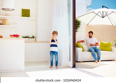happy family relaxing on rooftop patio with open space kitchen at warm summer day - Shutterstock ID 1026960424