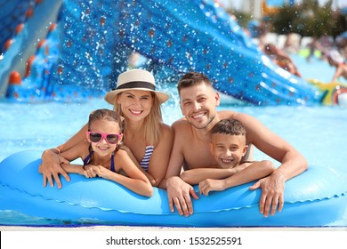 Happy Family Resting In Aqua Park