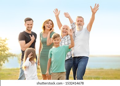 Happy family resting together in park - Shutterstock ID 1532414678