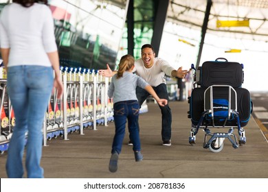 Happy Family Reunion At Airport