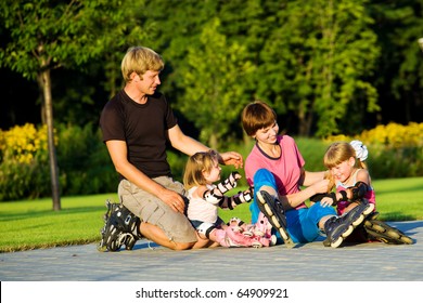 A Happy Family In Roller Skates