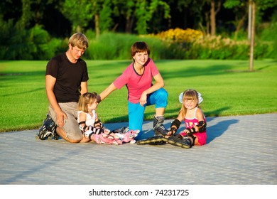 A Happy Family In Roller Skates