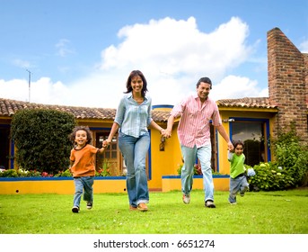 Happy Family Running And Having Fun Outdoors Smiling And Enjoying