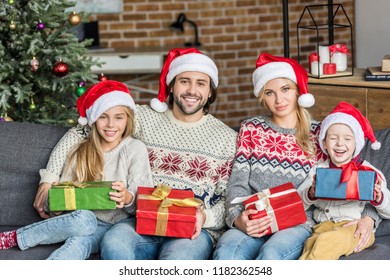 Happy Family Santa Hats Holding Christmas Stock Photo 1182362548 ...