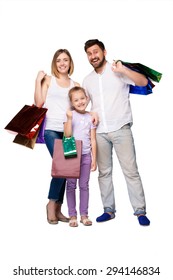 Happy Family With Shopping Bags Standing At Studio, Isolated On White Background