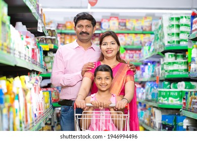 Happy Family Shopping For Groceries At The Supermarket