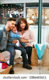 Happy Family Shopping And Having Fun In Mall