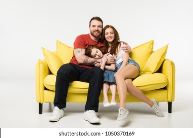 Happy Family Sitting On Couch Isolated On White