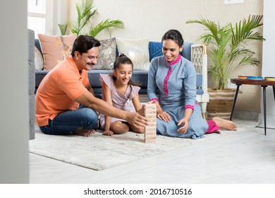 Happy Family sitting On floor Playing With The Wooden Blocks At Home - Shutterstock ID 2016710516