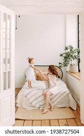 Happy Family Sleepy Funny Cute Beautiful Mom And Daughter Small Child Relaxing Lying On The Bed Playing Spending Time Together In A Cozy Bright Bedroom At Home, Mother's Day, Selective Focus