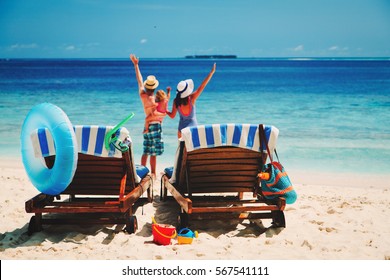 happy family with small child on tropical beach