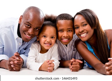 Happy family smiling and lying on the floor - isolated over white