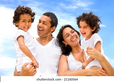 happy family smiling outdoors while on vacation