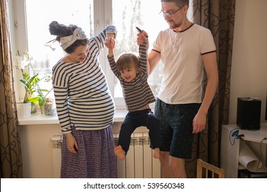 Happy Family With Son Kid Toddler Playing Around  Window, Home Real Interior, Lifestyle, Toning, Usual Family,  Evening Light Soft Focus