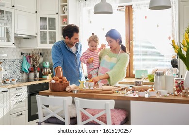 Happy family spending Easter together in the kitchen 