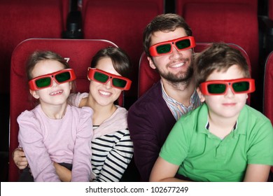 Happy Family Spending Time In 3D Movie Theater