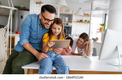 Happy Family Spending Time At Home And Using Digital, Technology Devices.