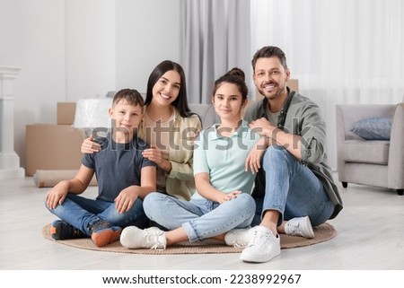 Happy family spending time in new apartment. Moving day