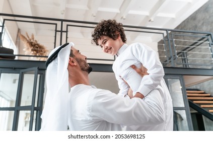 happy family spending time together. Arabian father and his son playing and making different activities at home - Shutterstock ID 2053698125