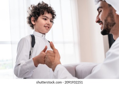 happy family spending time together. Arabian father and his son preparing to go to school