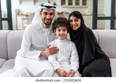 happy family spending time together. Arabian parents and their son playing and making different activities at home - Shutterstock ID 2115023624