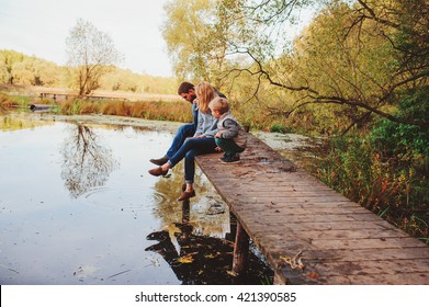 Happy Family Spending Time Together Outdoor. Lifestyle Capture, Rural Cozy Scene. Father, Mother And Son Walking In Forest