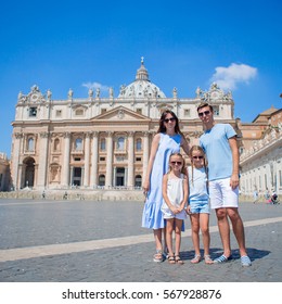 Happy Family At St. Peter's Basilica Church In Vatican City. Travel Parents And Kids On European Vacation In Italy.