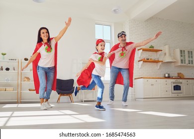 Happy Family In Super Hero Costumes.Funny Family Play Fun In The Room.