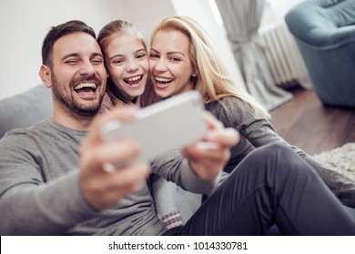 Happy Family Taking Selfie At Home.Family,love And Happiness Concept.