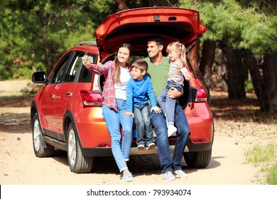 Happy Family Taking Selfie Near Modern Car Outdoors