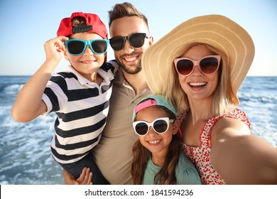 Happy Family Taking Selfie On Beach Near Sea. Summer Vacation