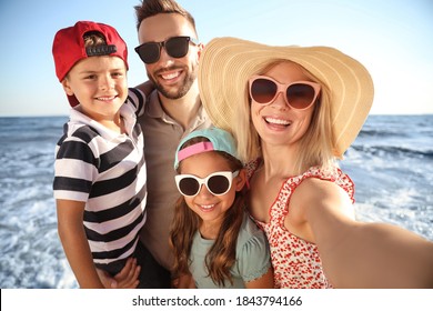 Happy Family Taking Selfie On Beach Near Sea. Summer Vacation