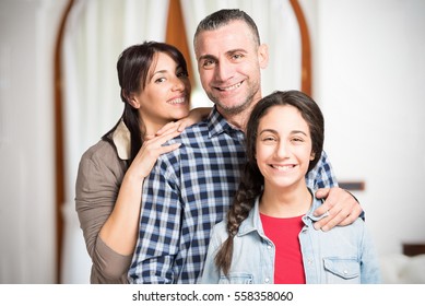 Happy Family In Their Home