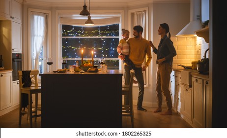 Happy Family of Three Having Great Time after Dinner Dancing Together. Strong Father Holds and Hugs Cute Little Daughter, They Dance Together with Beautiful Young Mother. Cozy Evening Celebration - Powered by Shutterstock