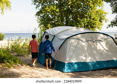 Happy Family, Three Kids, Boy Brothers And A Dog,playing Around Pitched Tent On The Beach, While Wild Camping In Norway, Summertime