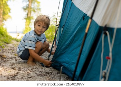 Happy Family, Three Kids, Boy Brothers And A Dog,playing Around Pitched Tent On The Beach, While Wild Camping In Norway, Summertime