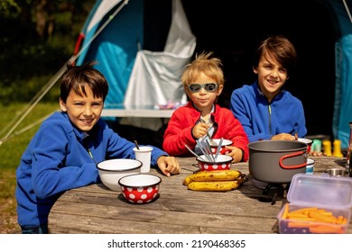 Happy Family, Three Kids, Boy Brothers And A Dog,playing Around Pitched Tent On The Beach, While Wild Camping In Norway, Summertime