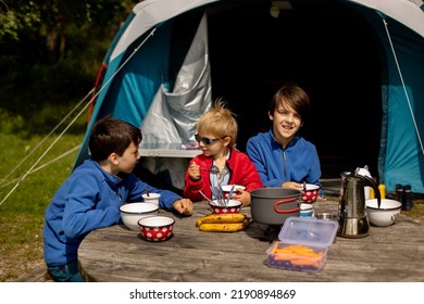 Happy Family, Three Kids, Boy Brothers And A Dog,playing Around Pitched Tent On The Beach, While Wild Camping In Norway, Summertime