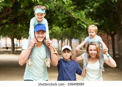 Happy Family With Three Kids Having City Tour In Summer Day 