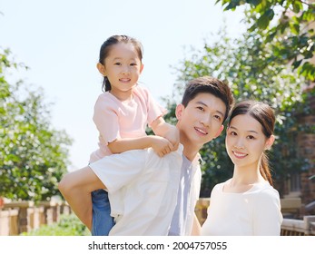 Happy Family Of Three In The Outdoor Group Photo High Quality Photo