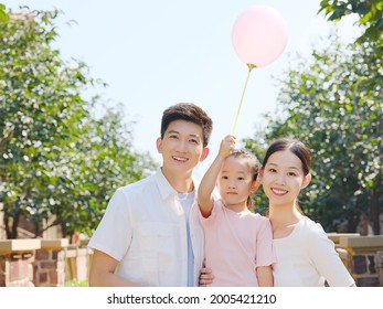 Happy Family Of Three In The Outdoor Group Photo High Quality Photo