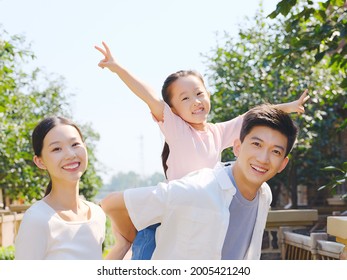 Happy Family Of Three In The Outdoor Group Photo High Quality Photo