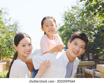 Happy Family Of Three In The Outdoor Group Photo High Quality Photo