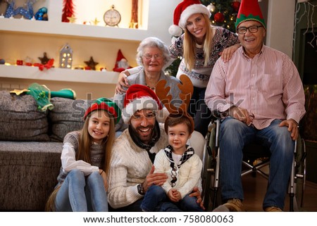 Happy family together in Christmas decorated home