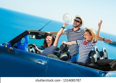 Happy Family Travel By Car To The Sea. People Having Fun In Cabriolet. Summer Vacation Concept