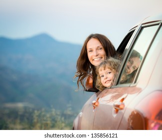 Happy Family Travel By Car In The Mountains. Summer Vacation Concept