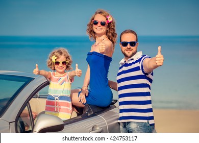 Happy Family Travel By Car To The Sea. People Having Fun In Cabriolet. Summer Vacation Concept