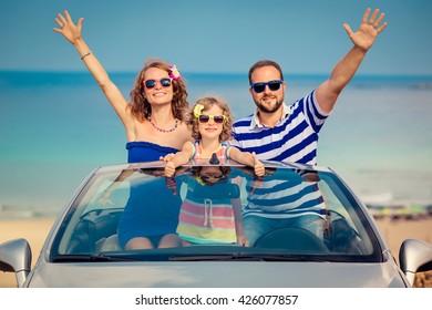 Happy Family Travel By Car To The Sea. People Having Fun In Cabriolet. Summer Vacation Concept